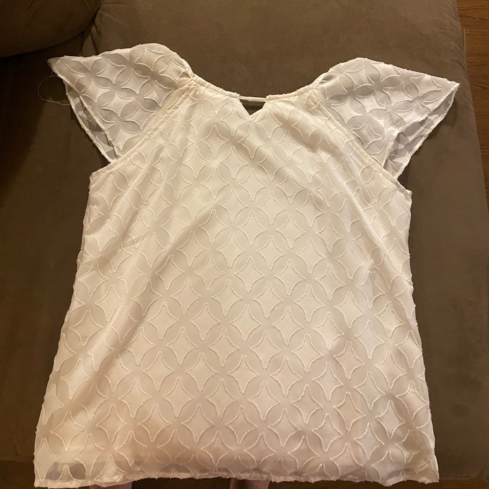 White patterned short sleeve top. Size medium. Maurices